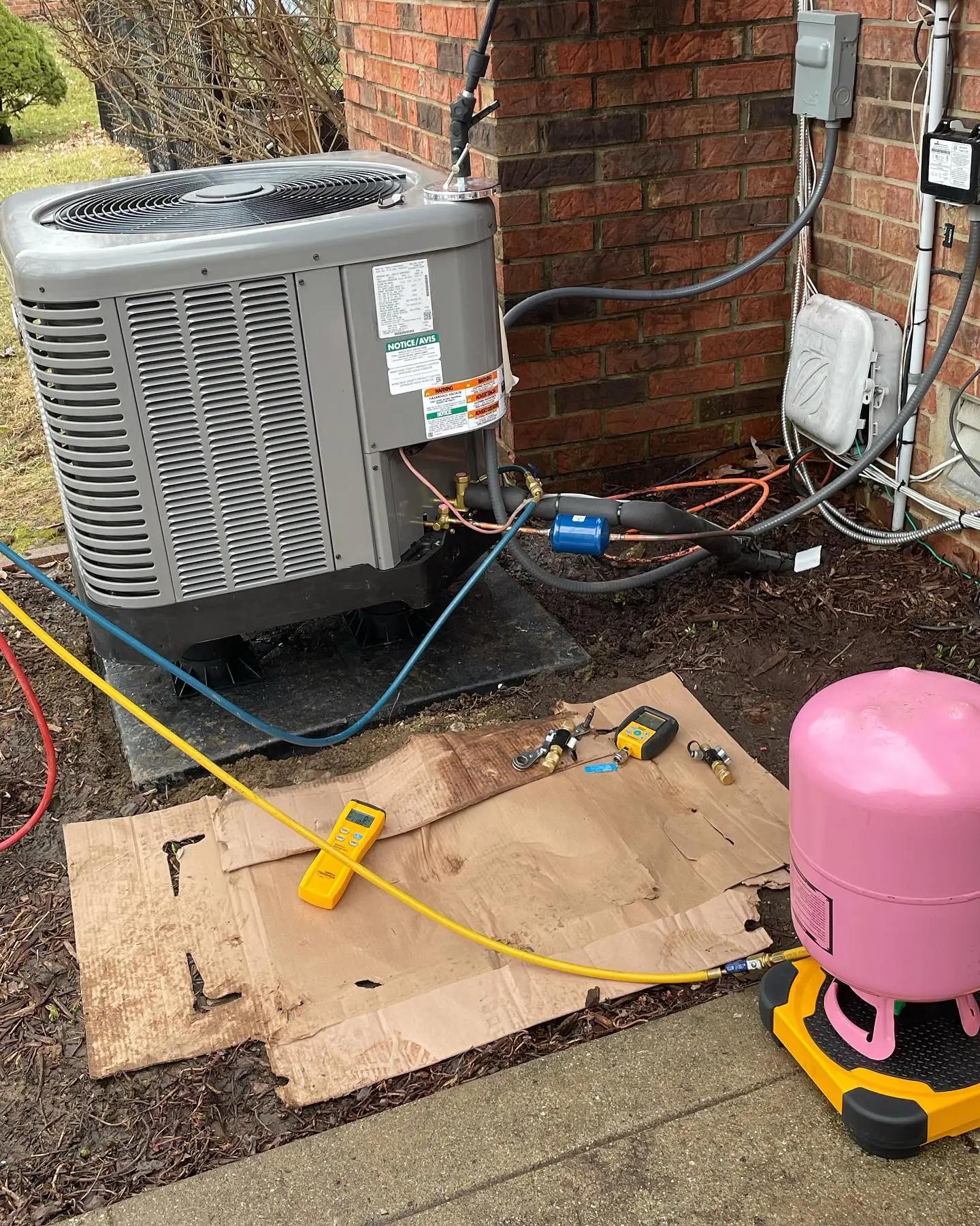 Polley's tech checking refrigerant on a Clayton, IN AC repair call
