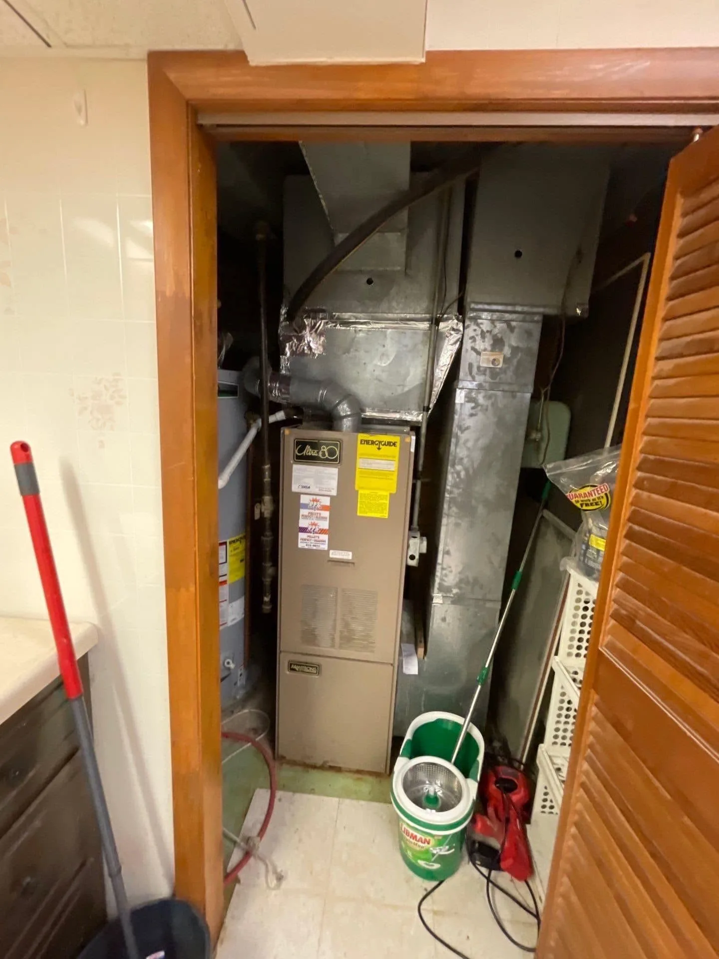 Old Armstrong water heater and furnace closet - Clayton-area repair