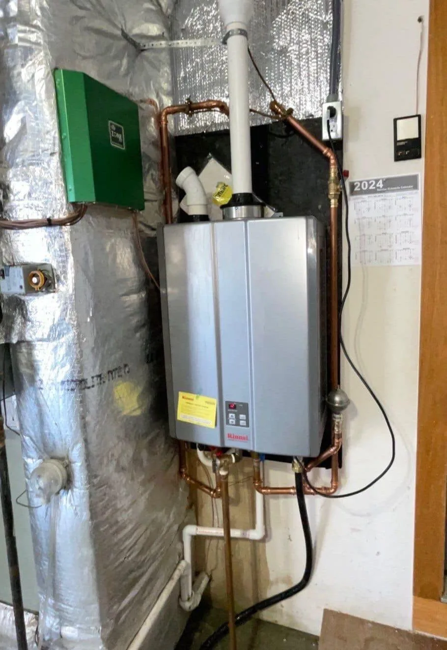 Wall-mounted Rinnai tankless water heater installed by Polley's Perfect Seasons in a Plainfield, IN basement