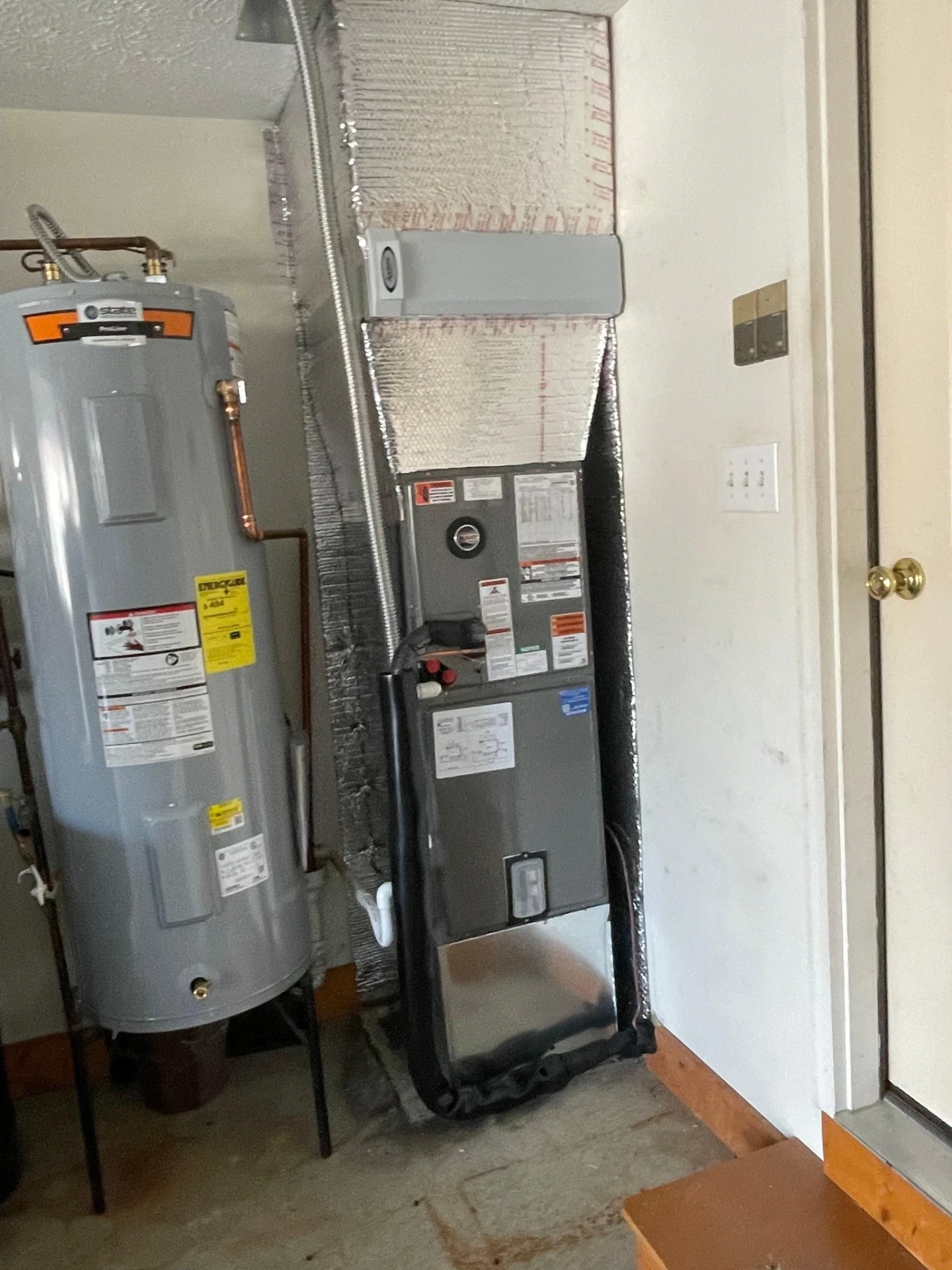 Tank water heater and furnace serviced in a Plainfield, IN garage